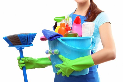 Technician managing carpet cleaning equipment in a controlled work area
